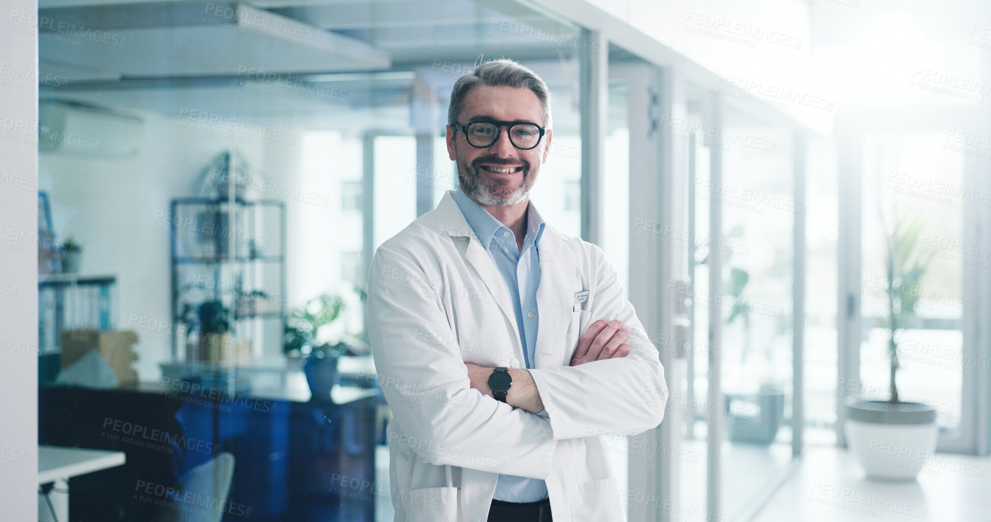 Buy stock photo Happy, crossed arms and portrait of doctor in hospital with confidence for medical support career. Smile, professional and mature male healthcare worker from London with pride for service in clinic.