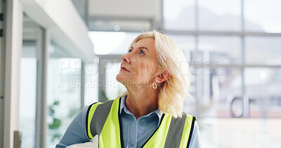 Buy stock photo Engineer, construction site and mature woman for urban planning, thinking or decision for architecture development. Inspection, insight and contractor with project management for civil engineering