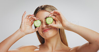 Buy stock photo Cucumber, skincare and woman in studio, beauty and natural cosmetics on white background. Space, organic fruit and person with wellness, dermatology and detox with aesthetic, glow and diet benefits