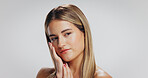 Face, skincare and woman thinking in studio, cosmetics or spa treatment for beauty. Self care, facial routine and healthy person with space for smooth skin, makeup or dermatology on white background