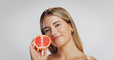 Buy stock photo Grapefruit, skincare and portrait of woman in studio for beauty, facial and detox on white background. Dermatology, space and person with organic products, natural cosmetics and vitamin benefits