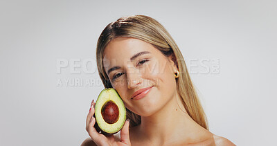 Buy stock photo Avocado, skincare and portrait of woman in studio for beauty, wellness and detox on white background. Dermatology, space and person for organic treatment, natural cosmetics and vitamin benefits