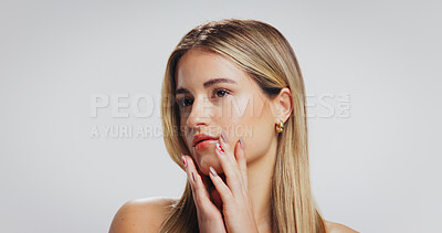 Buy stock photo Beauty, woman and glow with skincare in studio for anti aging, healthy skin and self care. Mockup space, girl and touch face on white background for acne treatment results, natural makeup or wellness