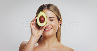 Buy stock photo Avocado, beauty and happy woman in studio for skincare, wellness and detox on white background. Mockup, space and face of person with organic products, natural cosmetics and dermatology benefits