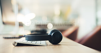 Buy stock photo Call center, keyboard and communication with headset in empty office for customer support, help desk or crm. Contact us, sales hotline and lead generation with headphones in agency interior for bokeh