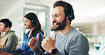 Man, call center and thumbs up with smile at office, contact and headset for customer service solution. Person, agent and consultant with symbol, advice and happy with yes sign for problem solving