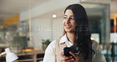 Buy stock photo Woman, phone and thinking for texting at office, smile or space for contact, lead or story at media agency. Person, writer or journalist with smartphone, happy on mobile app for networking at company