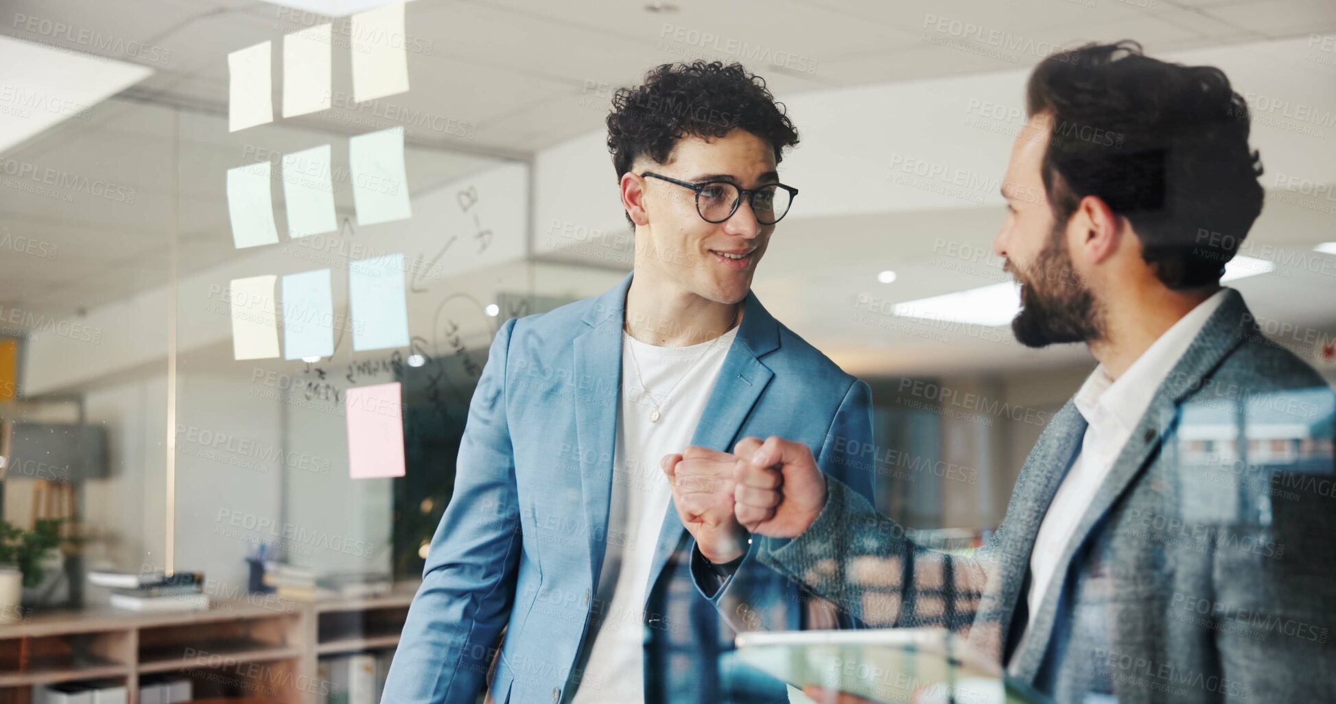 Buy stock photo Business men, meeting and fist bump with tablet in office for notebook, document feedback and schedule advice. Employees, digital tech and smile for proposal planning, agenda or briefing conversation