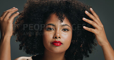 Buy stock photo Hair, hands and portrait with woman in studio for beauty, growth or natural volume of afro. Aesthetic, conditioner and shampoo with African model isolated on gray background for haircare results