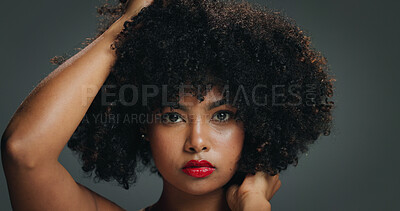 Buy stock photo Portrait, face and woman in studio with afro, makeup and  organic cosmetic for healthy curls. Proud, confident and African female person with beauty, natural hair care and lipstick on gray background