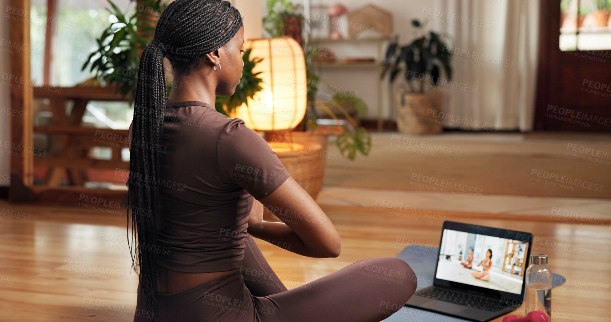 Buy stock photo Back, meditation and online yoga class with black woman in home for awareness or holistic health. Balance, inner peace and laptop screen with person in apartment for video streaming of zen course