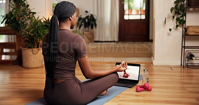 Buy stock photo Balance, meditation and online yoga class with black woman in home for awareness or holistic health. Back, inner peace and laptop screen with person in apartment for video streaming of zen course