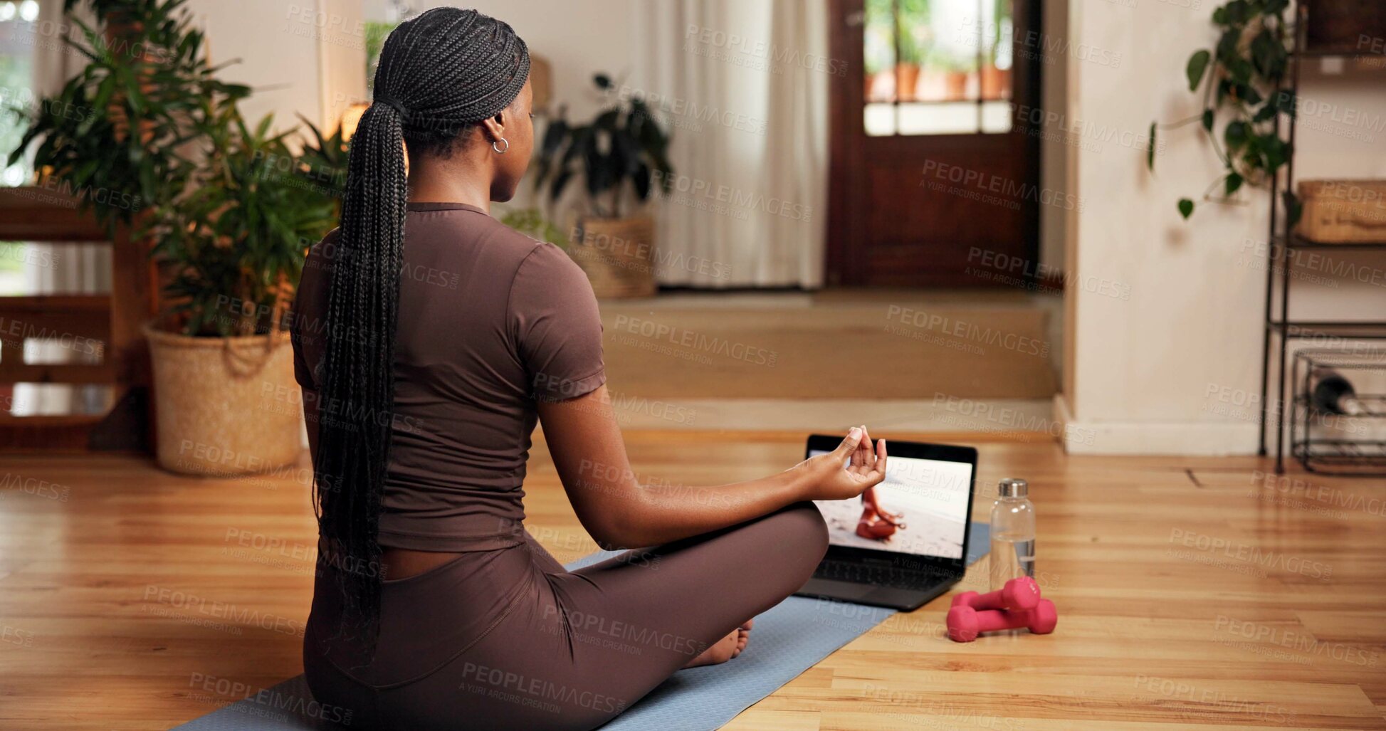 Buy stock photo Balance, meditation and online yoga class with black woman in home for awareness or holistic health. Back, inner peace and laptop screen with person in apartment for video streaming of zen course