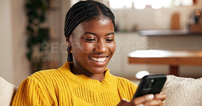 Buy stock photo Black woman, phone and relax in home with social media, text message and reading online blog. Person, mobile and smile on living room sofa for funny email, meme website and chill with chat platform