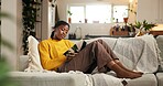 Relax, black woman and reading a book on sofa for story, knowledge and literature study. University student, person and best seller fantasy novel in home for learning, thesis information or education
