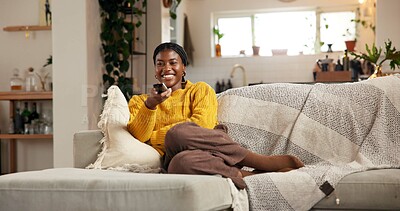 Buy stock photo Happy, black woman and watching tv on sofa with remote for channel, movie or entertainment in home. Female person, user or smile with online subscription for series, news or show on couch in house