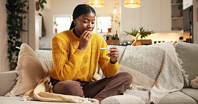 Buy stock photo Pregnancy test, surprise and black woman on sofa in home with fertility, ivf success and good news. Happy, relax and African female person with positive result on pregnant stick in living room.
