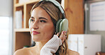Music, remote work and thinking with woman in home office for small business or startup career. Headphones, relax and streaming with thoughtful freelance employee listening to audio in apartment
