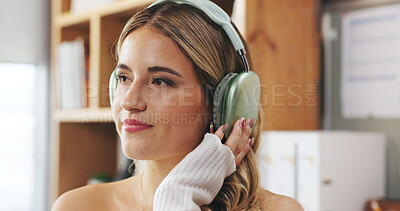 Buy stock photo Music, remote work and thinking with woman in home office for small business or startup career. Headphones, relax and streaming with thoughtful freelance employee, listening to audio and apartment