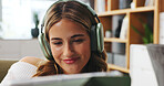Smile, woman and headphones with tablet at house for streaming, social media and listening to music. Happy, female person and digital for movie search, film audio and playlist sound in living room