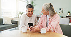 Coffee, phone and smile with old women in living room of home for bonding, share or visit. App, showing and social media with happy senior friends at table together for communication or sharing news