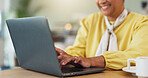 Remote work, laptop and hands of woman in cafe with research, planning or editing blog content. Coffee shop, typing and online freelancer with social media, communication or restaurant review