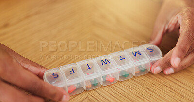 Buy stock photo Sorting, pills and hands with box for medicine, prescription treatment and chronic healthcare. Daily vitamin, tablets and person with space for medical drugs, capsule and supplements organization