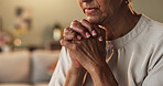 Hands, hope and prayer with senior woman in living room of home for belief, confession or religion. Faith, trust and worship with old Christian person praying to God or Jesus for gratitude and peace