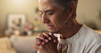 Buy stock photo Faith, hope and prayer with senior woman on sofa in living room of home for trust in Christ Jesus. Belief, religion and worship with old person praying to God for confession, forgiveness or guidance