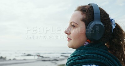 Buy stock photo Mindfulness, tourist and woman with headphones, beach or music on vacation, streaming and breathing. Outdoor, space and person with tech for sound, calm and listening to radio on holiday and break