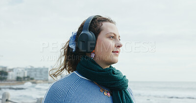 Buy stock photo Calm, thinking and woman with headphones, beach or listening to music on vacation, happy and online. Outdoor, space and person with tech for sound, reflection and streaming playlist on holiday