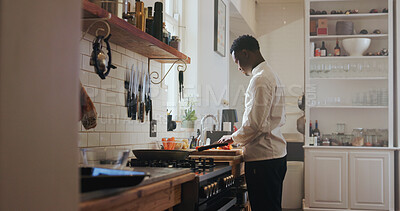 Buy stock photo Cooking, ingredients and vegetables with black man in kitchen of home for meal preparation or recipe. Chopping, culinary skills and food with chef person in apartment for diet, health or nutrition