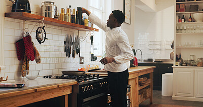Buy stock photo Cooking, decision and spices with black man in kitchen of home for meal preparation or recipe. Culinary skills, food and selection with chef person in apartment for diet, health or nutrition