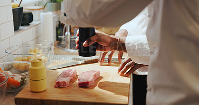 Buy stock photo Chef hands, people and steak seasoning in kitchen for meal prep, learning and enhance flavor. Restaurant, mentor and intern with spices on beef for cooking meat recipe, culinary skill and guidance