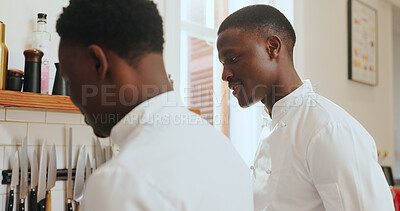 Buy stock photo Chef, cooking and men with learning in kitchen for recipe tutorial, meal prep and menu tips. Culinary intern, mentor and black people in restaurant for training guidance, cuisine knowledge and lesson