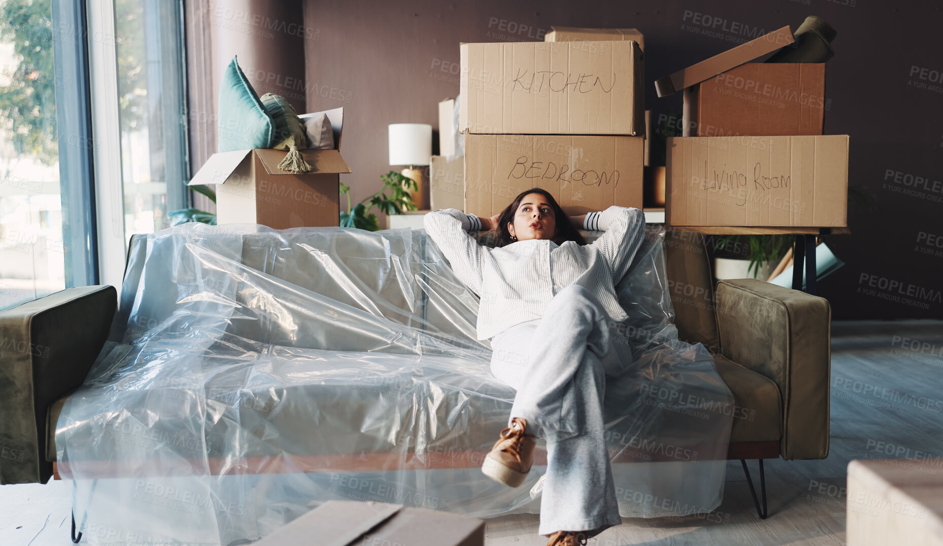 Buy stock photo Tired, relax and moving with woman on sofa of new home for property investment, renovation and resting. Relocation fatigue, furniture and real estate burnout with person for exhausted and break