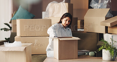 Buy stock photo Woman, unpacking boxes and moving to new home with real estate investing, mortgage and fresh start. Person, cardboard package and relocation with smile, organize and property purchase at apartment