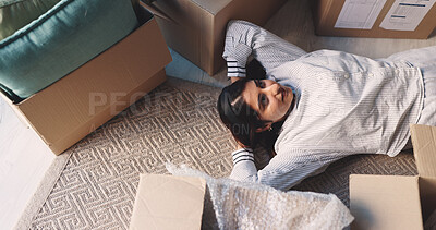 Buy stock photo Woman, new home and thinking with boxes on floor, smile and relax on break, moving and above in lounge. Person, happy and tired on carpet with package, relocation or property investment at apartment
