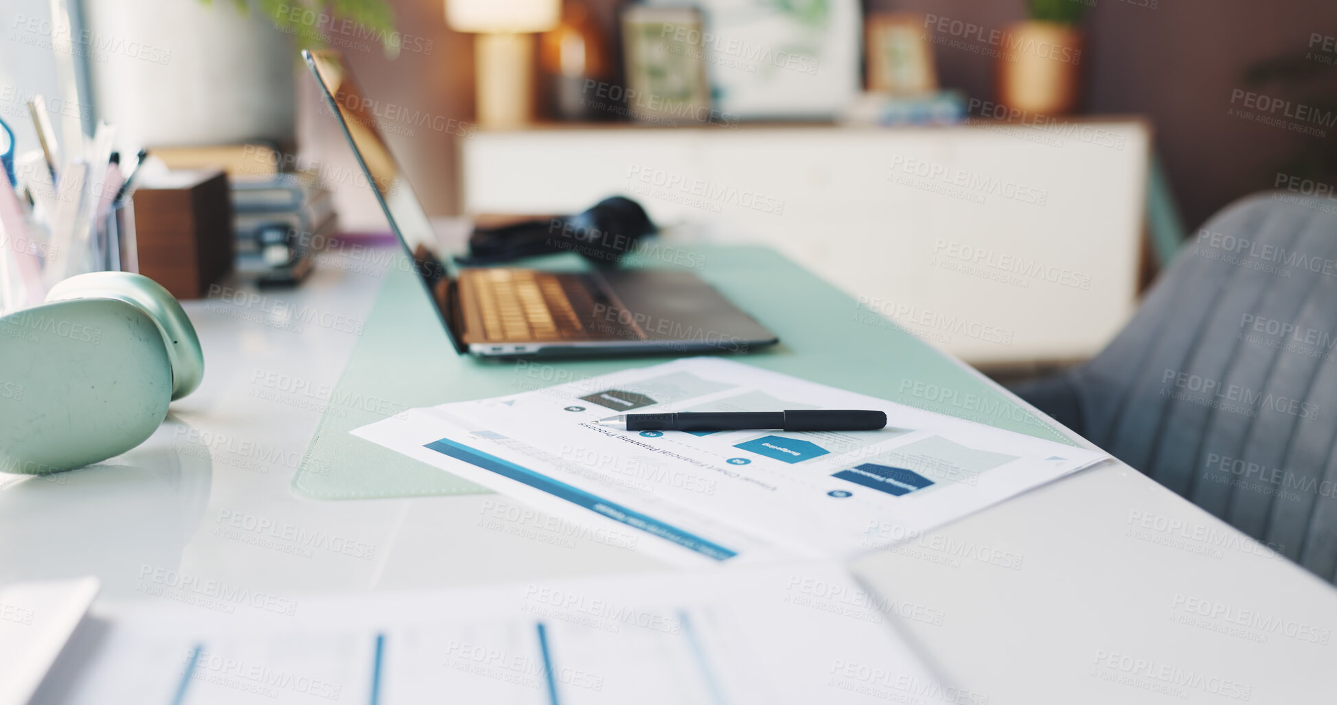Buy stock photo Headphones, laptop and paperwork on desk in home office for planning, remote work or research. Computer, creative workstation and documents in empty apartment for freelance or small business startup