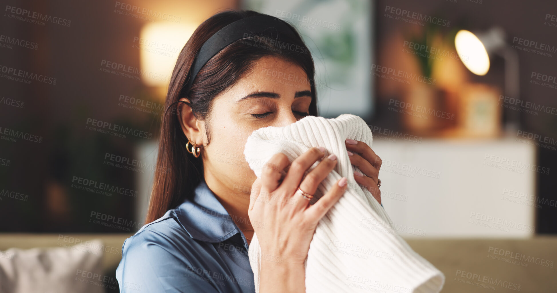 Buy stock photo Woman, laundry or smell clothes in home, fresh fragrance or soft fabric texture for linen maintenance. Hygiene, detergent scent or person with dry washing to fold, housekeeping or clean cotton.
