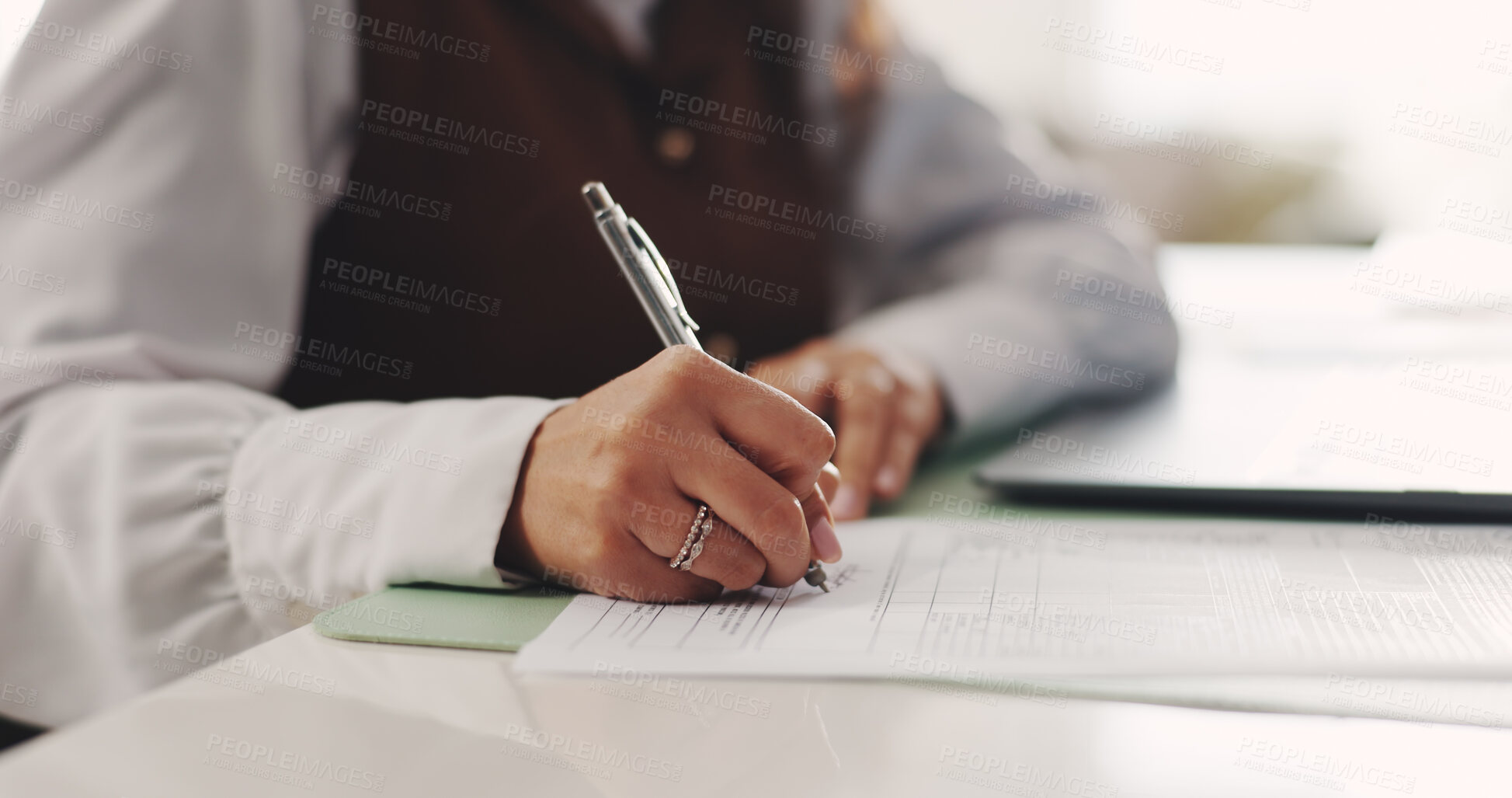 Buy stock photo Contract, hands and signature with business woman at desk in office to sign draft or proposal. Compliance agreement, documents and legal paperwork with employee writing for management approval
