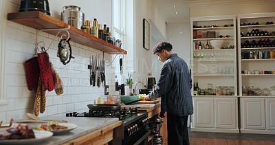 Buy stock photo Cooking, home and man with vegetables in kitchen for meal prep, healthy lunch and dinner recipe. Counter, food and person with ingredients, cuisine and cutting for nutrition, vitamins and wellness 