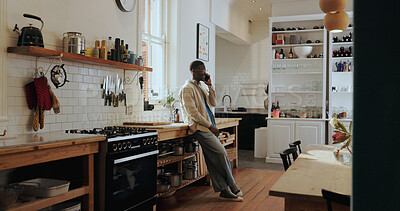 Buy stock photo Listen, phone call and happy black man in kitchen for chat, gossip or communication with contact. African person, smile and conversation with mobile for news, story or feedback for connection in home