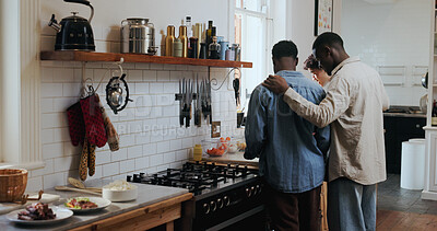 Buy stock photo Back, friends and men in kitchen with food, speaking and lunch with conversation for diet. Meal prep, health or nutrition in discussion with group, reunion or hunger in apartment bonding for weekend