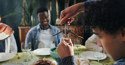 Buy stock photo Friends, people and open wine bottle at dinner for reunion party, social gathering and celebration. Home, hands and corkscrew for alcohol drink, start brunch event and dining together in living room