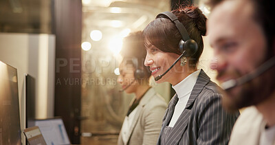 Buy stock photo Talking, coworkers and woman with headset in call center, night and communication for telemarketing. Working late, chat and people with mic for lead generation, consultant and conversation for sales