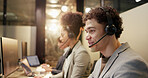 Happy, man and coworkers with headset in call center, working late or discussion for lead generation. Night, consultant and people with mic for communication, telemarketing and conversation for sales