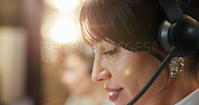 Buy stock photo Call centre, closeup and woman in office with headset, bokeh and telecom in customer service. Night, online and sales agent in workspace with tech, virtual advice and support in client assistance.