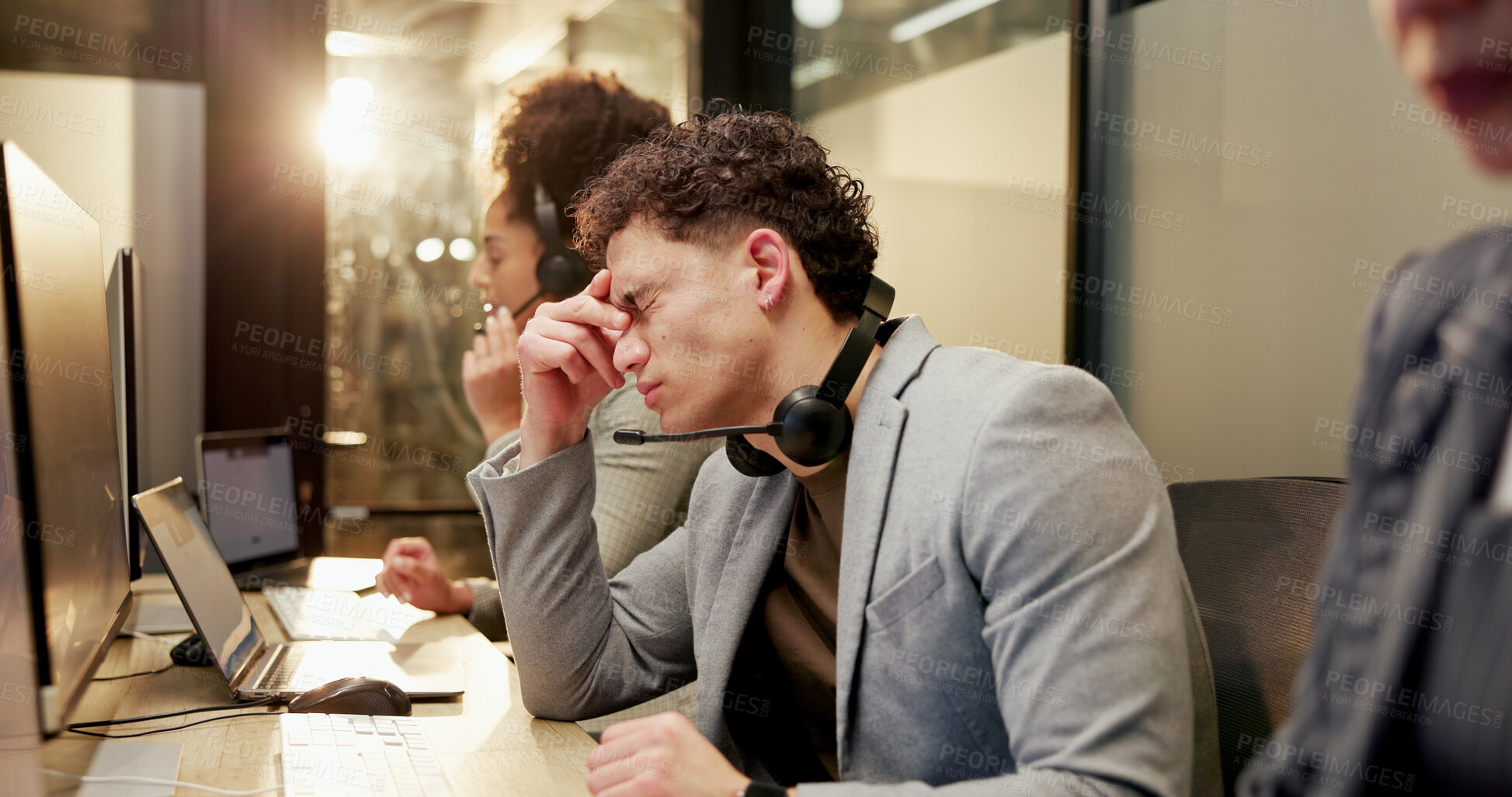 Buy stock photo Man, stress and headache with computer at call centre for customer service, crm and client complaint. Night, person and coworking with migraine, tech support deadline and agent burnout for compliance