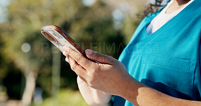 Buy stock photo Hand, phone or nursing student on campus with typing, research or notification for assessment. Email, reading or woman in uniform with tech, education or internet in school with info for results.